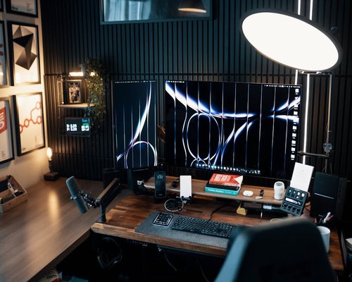 Modern well-lit home office desk setup with ergonomic computer placement