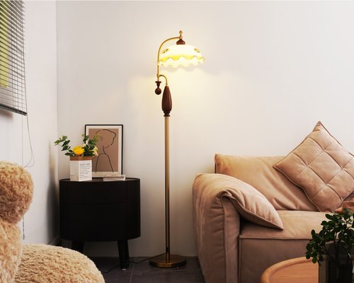 Cozy living room corner with a reading lamp providing warm soft light over an armchair